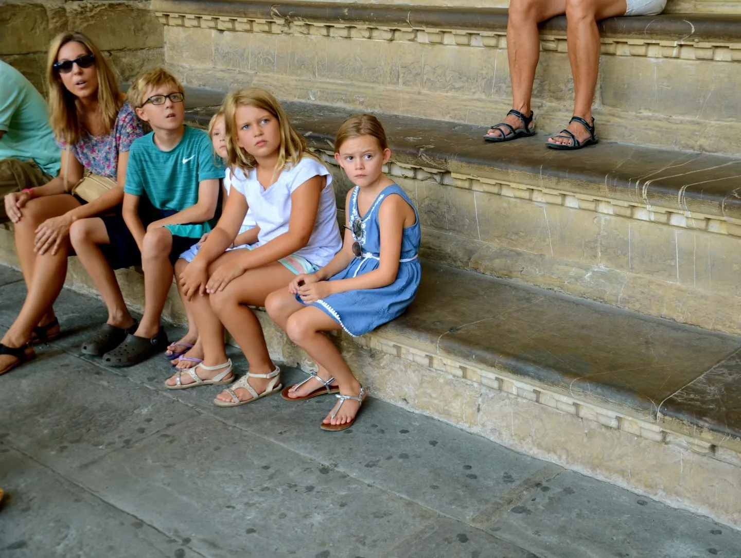 Sitting up the steps for a break in the pizza della signoria in Florence.