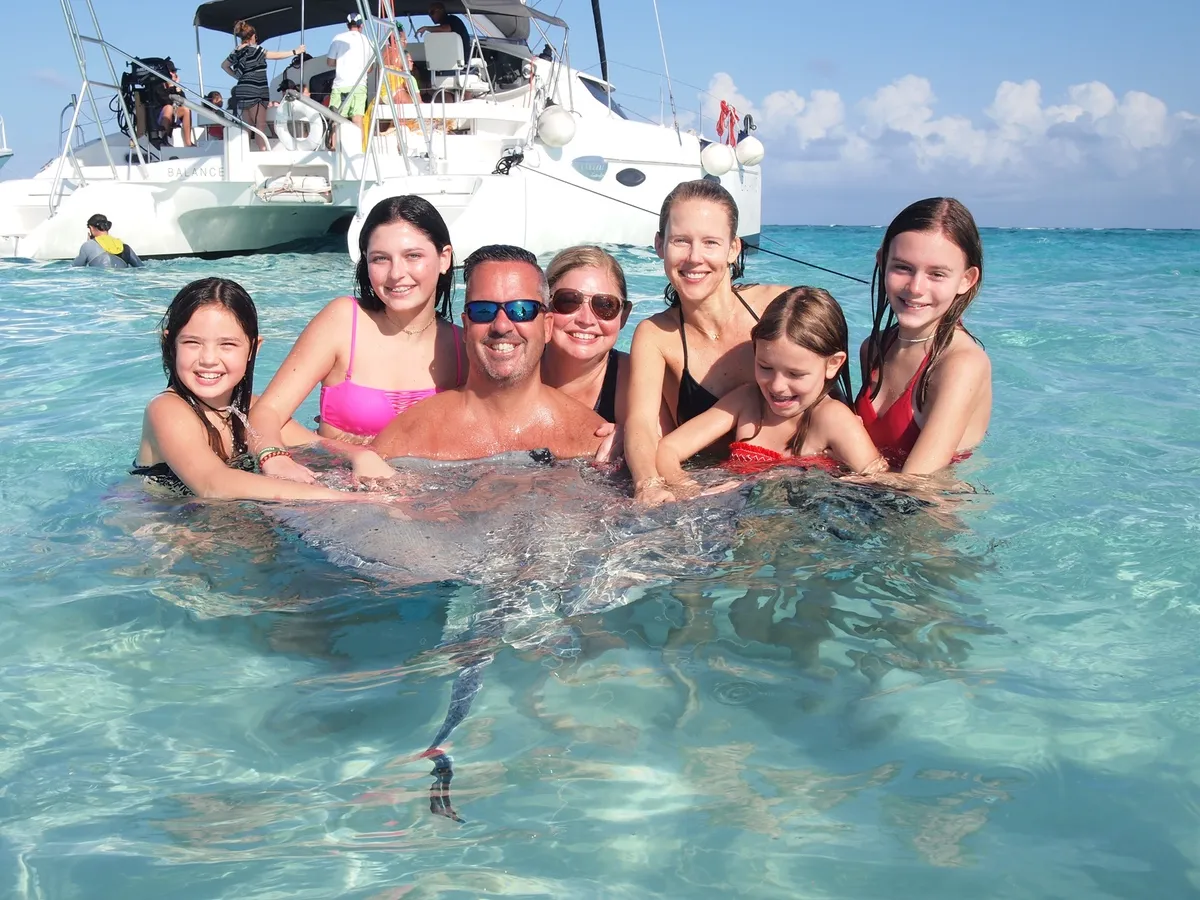 Playing with a stingray at Stingray City in Grand Cayman