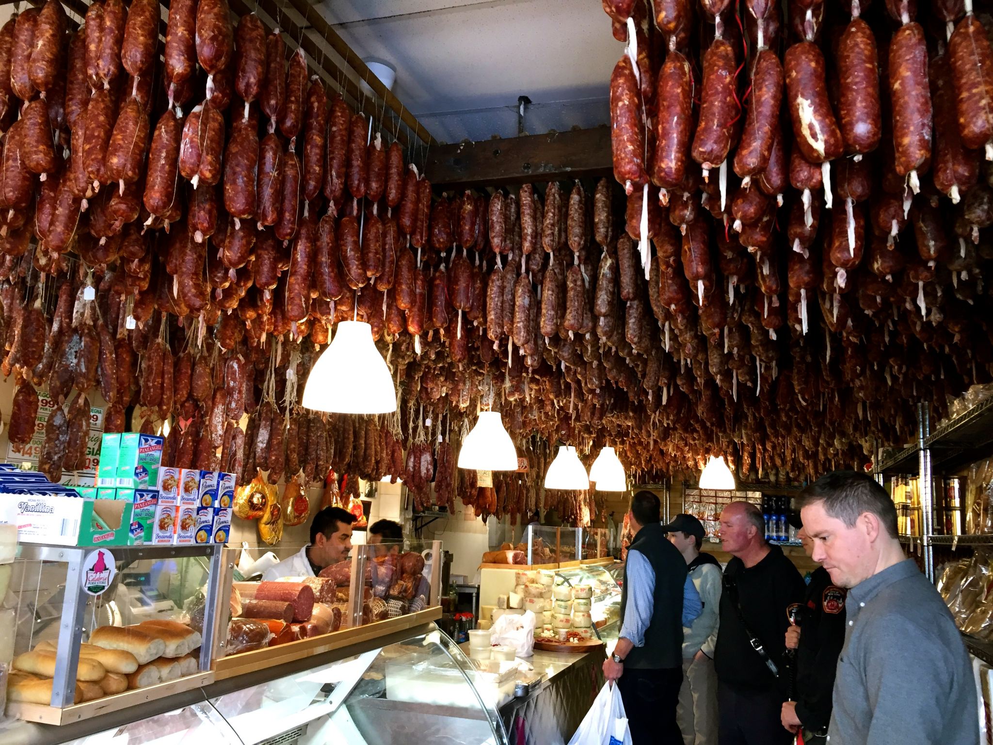 Checking out a meat market on Arthur Avenue in the Bronx, New York City.