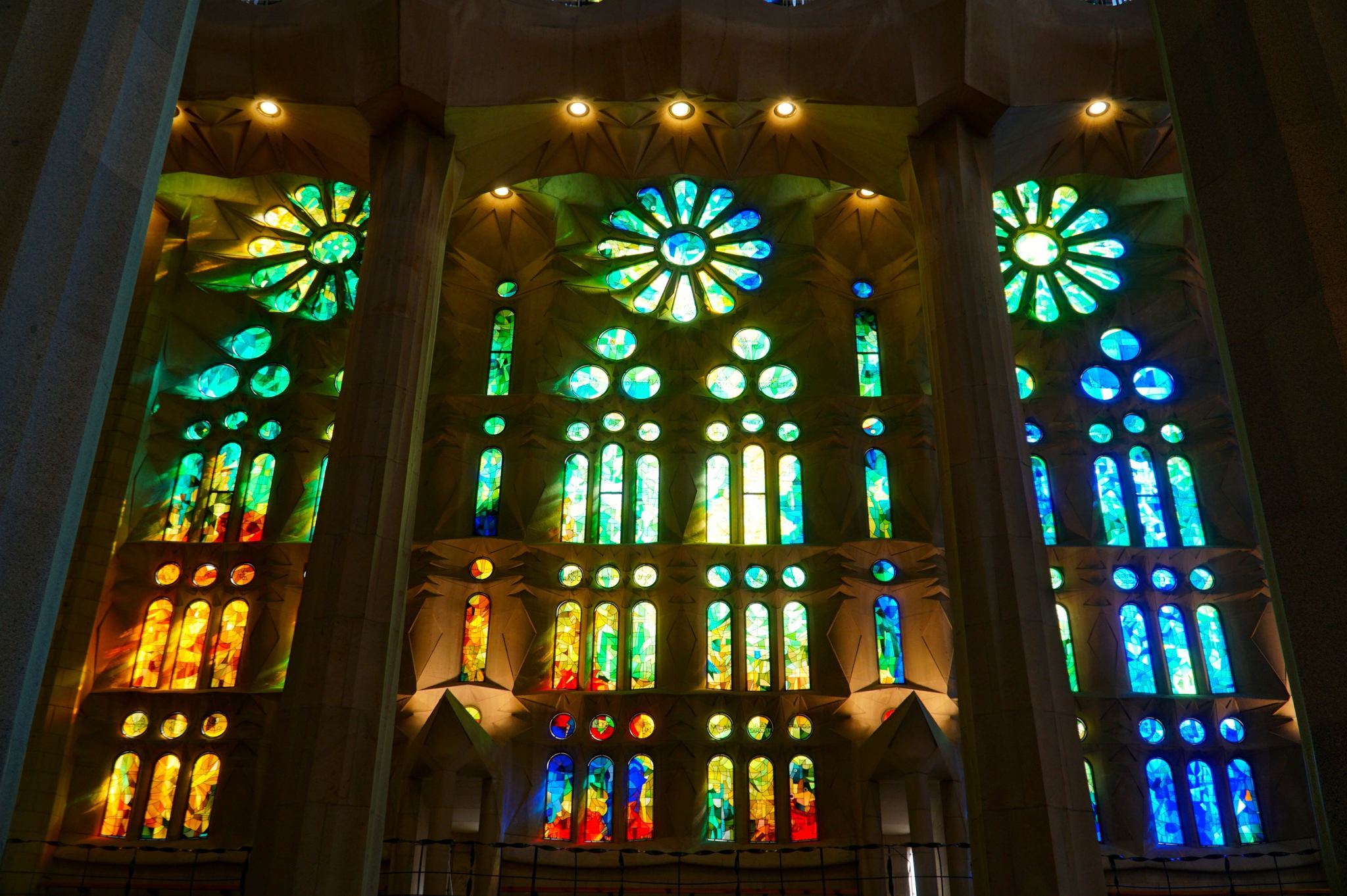 Looking at the stained-glass windows in the Sagrada Familia by Gaudi.