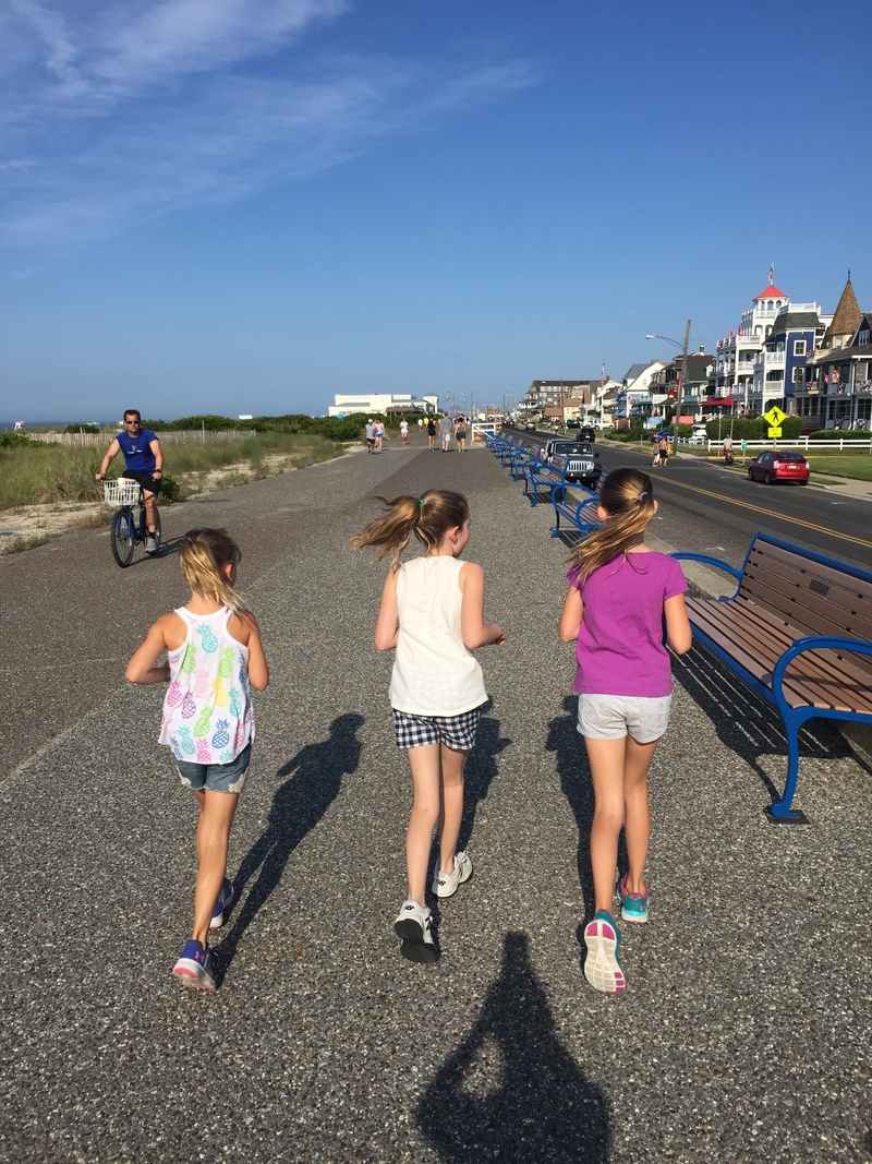 Girls running along the promenade in Cape May, New Jersey.