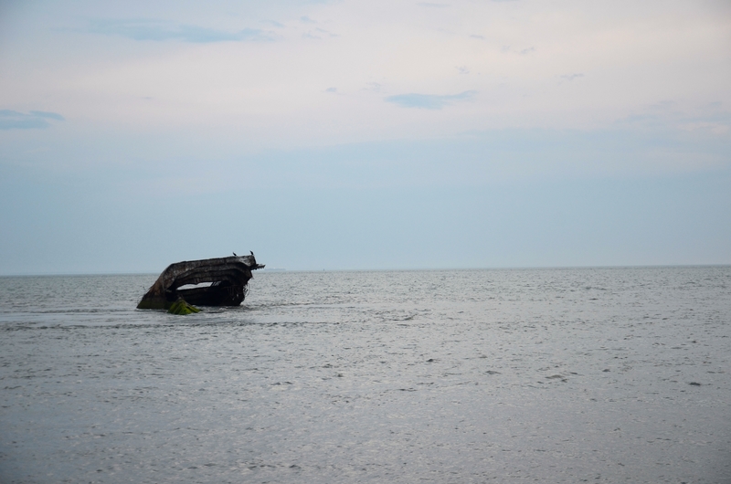 Watching the sunset and Atlantus shipwreck at Sunset Beach in Cape May, New Jersey.