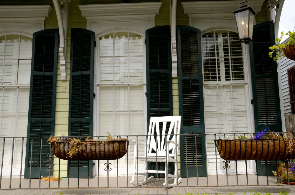 Admiring the porches with rocking chairs in the Garden District of New Orleans.