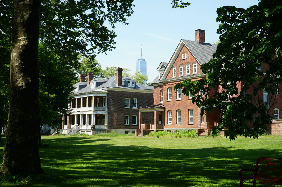 Historical buildings against the backdrop of the Manhattan skyline on Governors Island in New York