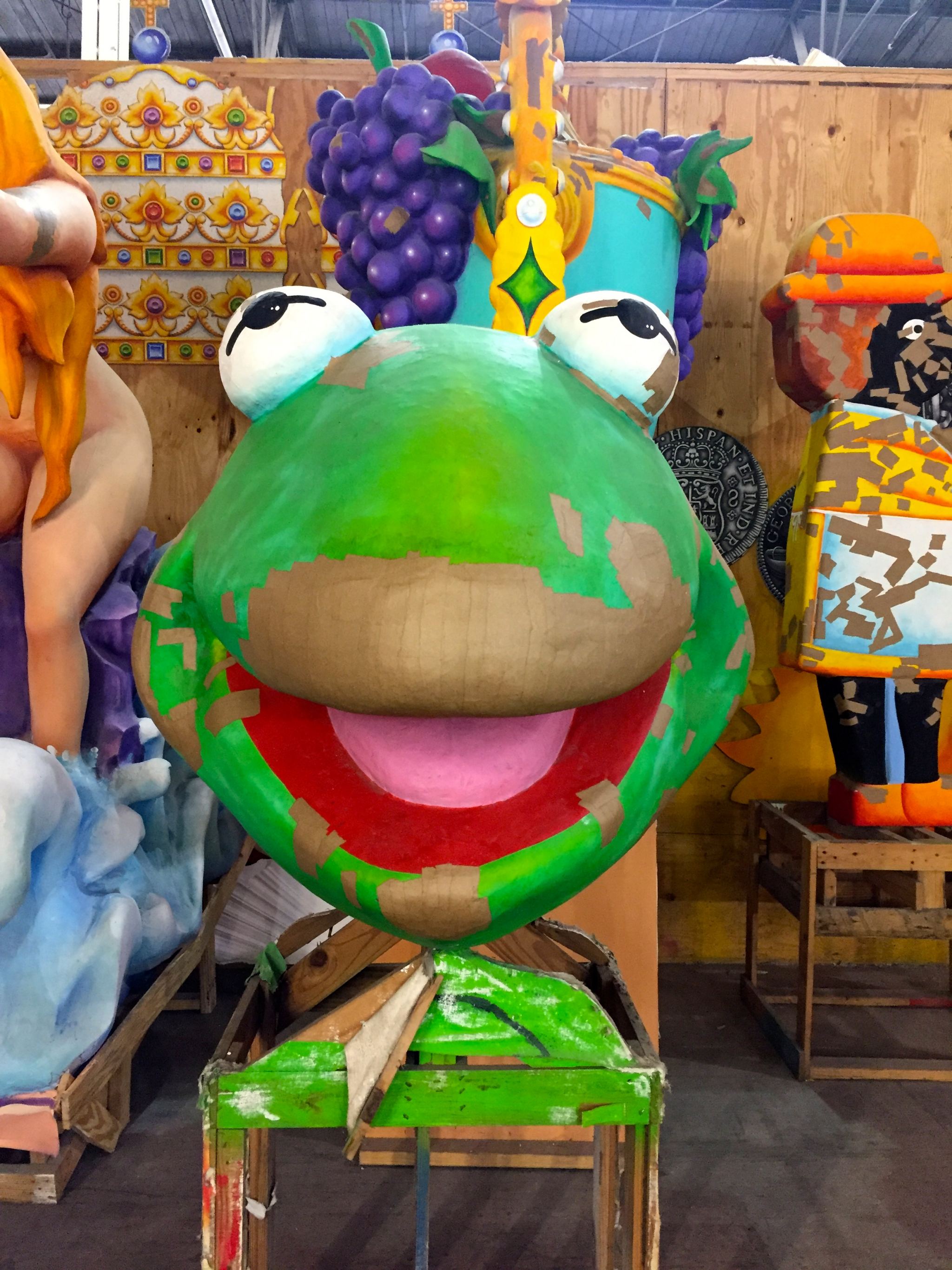 Admiring the Kermit the Frog float at Mardi Gras World in New Orleans.