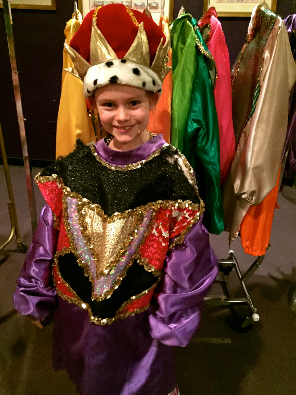 Trying on costumes at Mardi Gras World in New Orleans