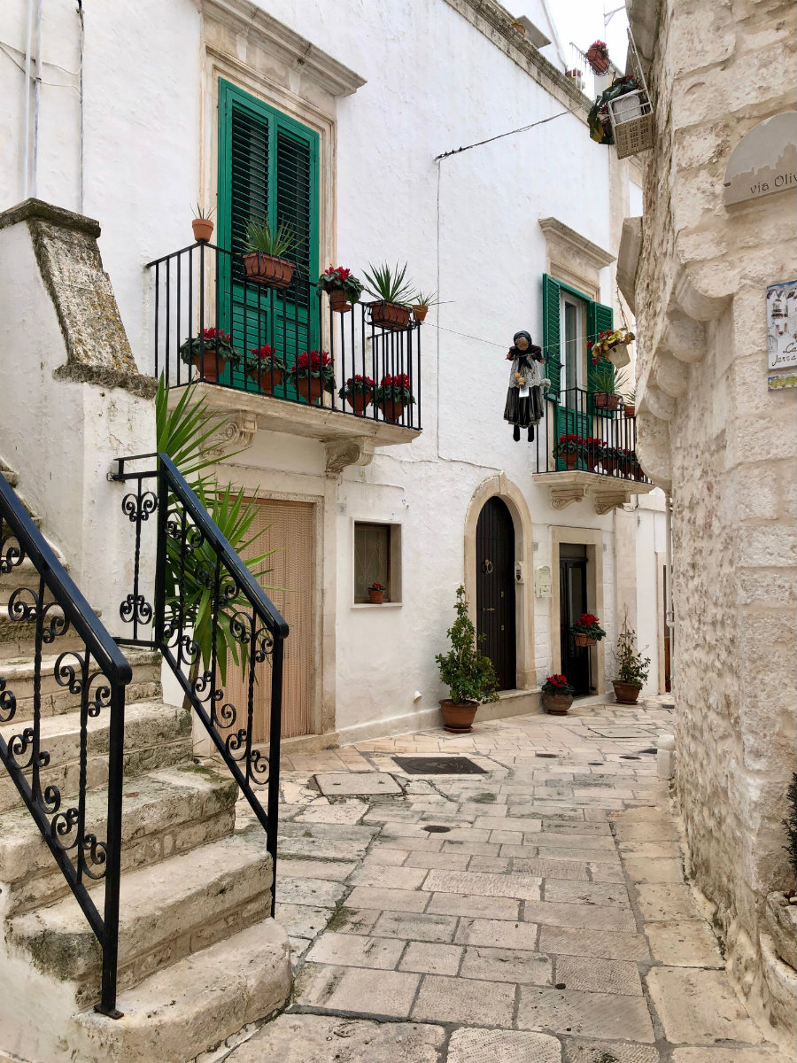 The white washed buildings and green shutters of Locorotondo
