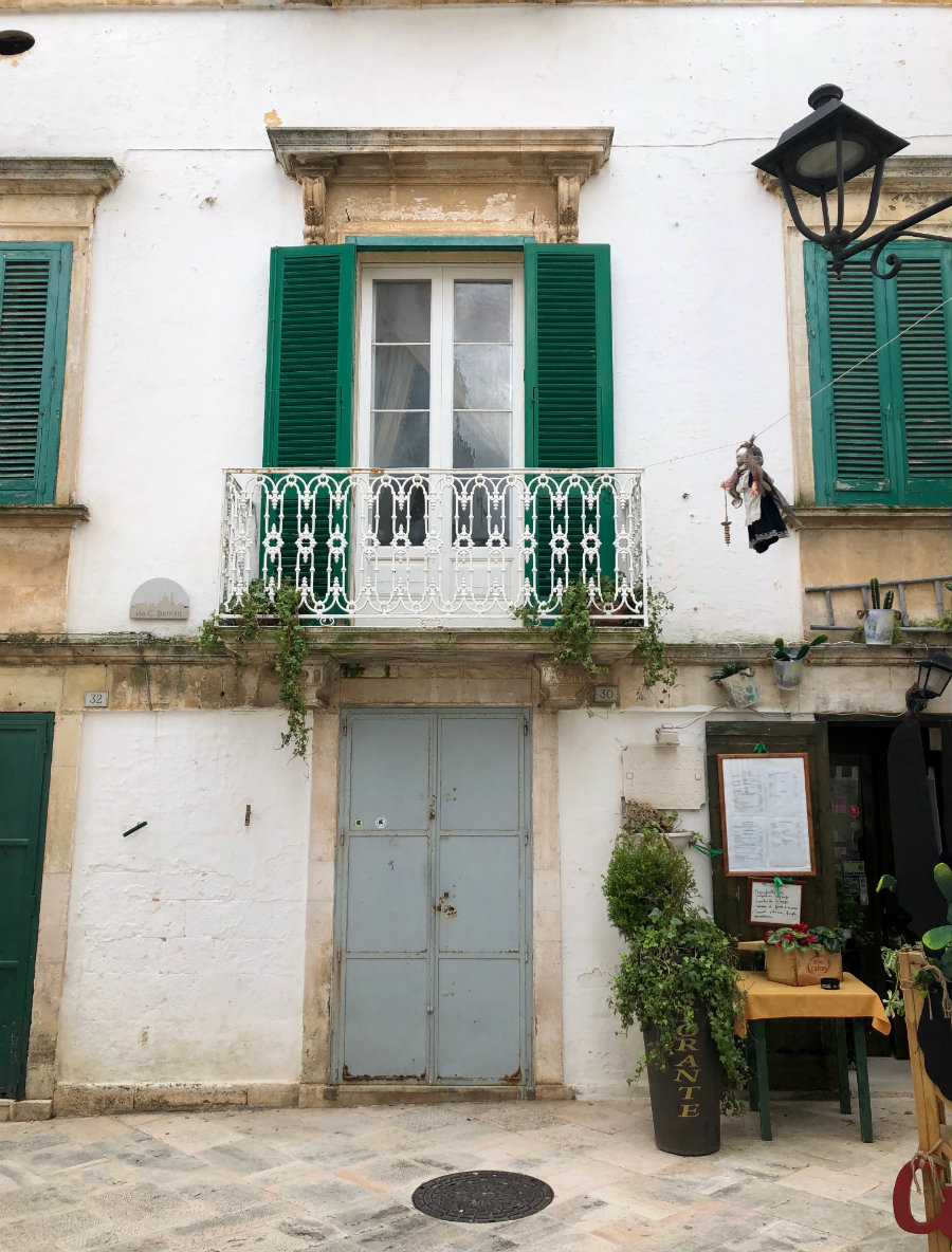 Green shutters of Locorotondo in Puglia, Italy