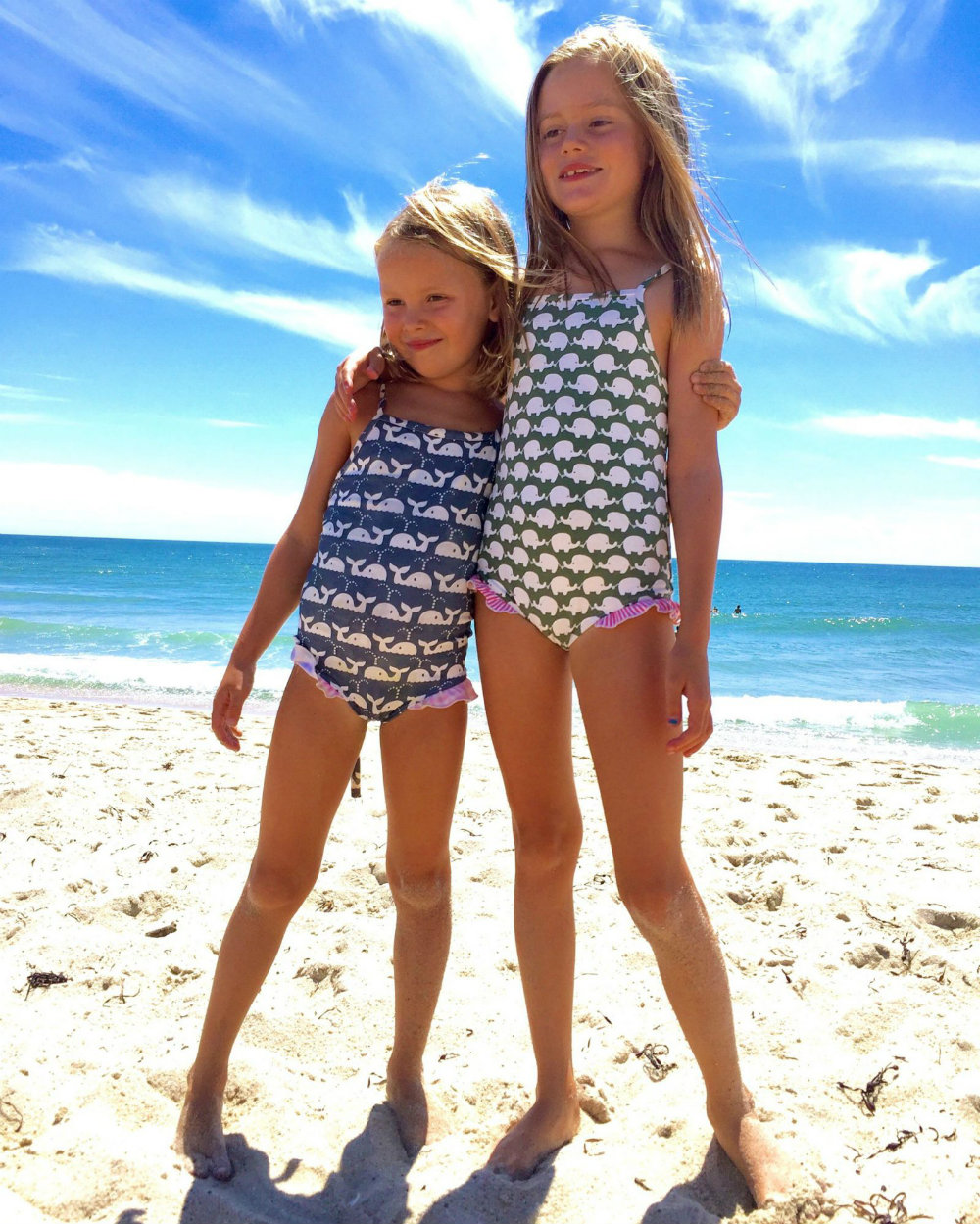 Girls posing for a photo on the beach in Nantucket.