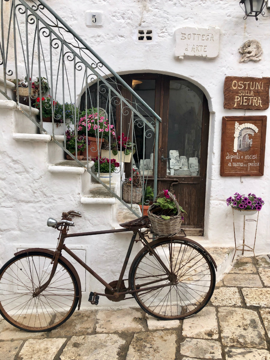 Perfect restaurants entryway with the bike in front in Ostuni Italy