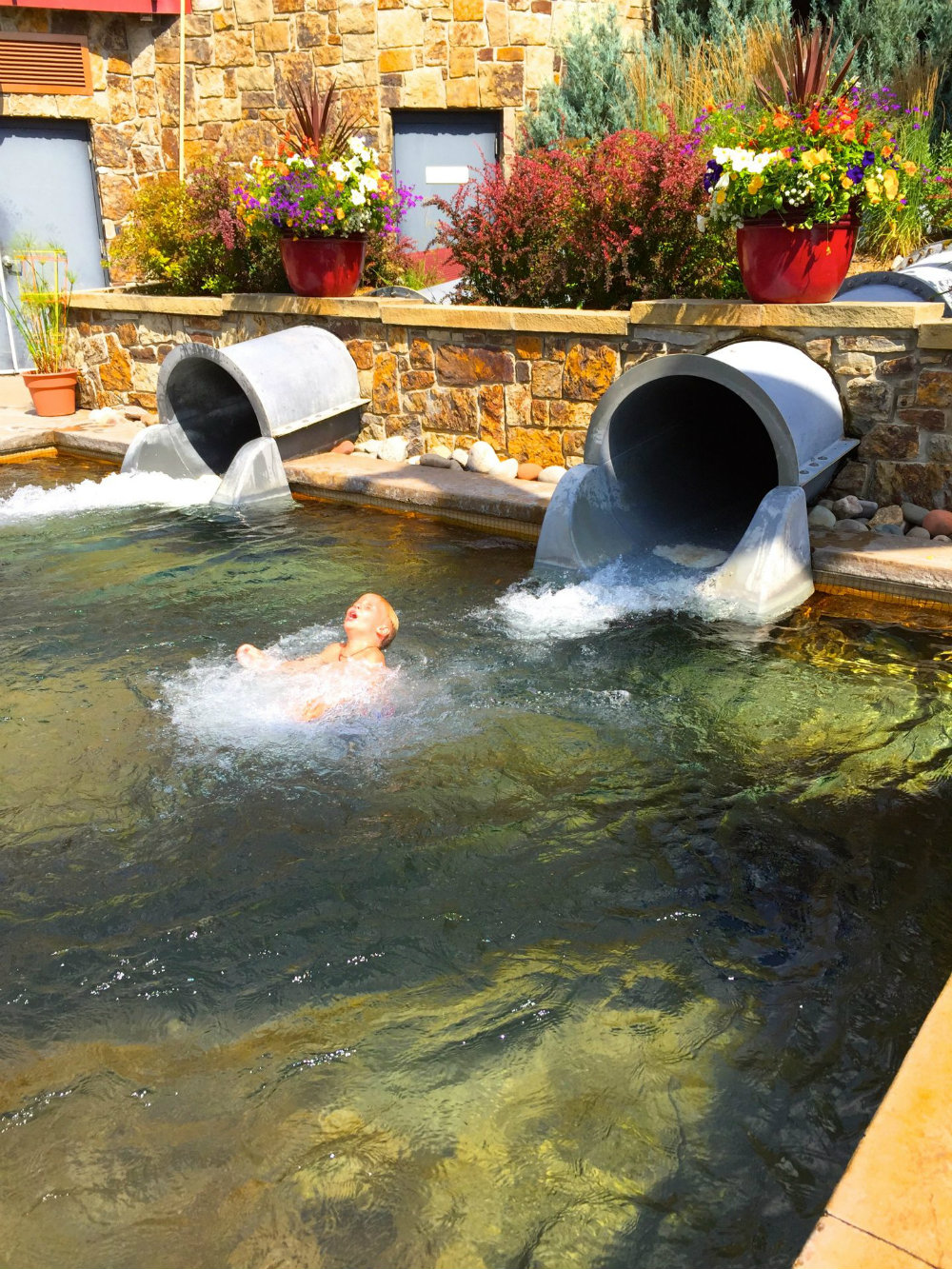 Coming out of the water slide at Old Town hot springs in Steamboat Springs, CO.