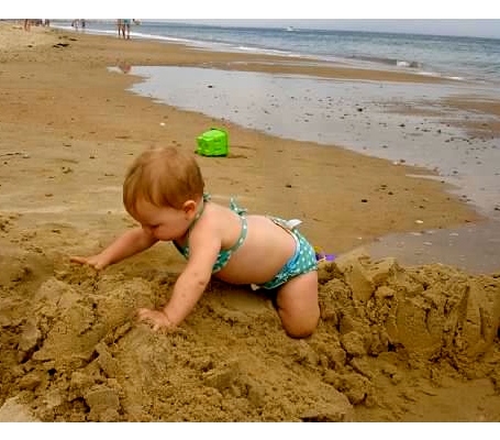 Playing in the sand at the beach in Watch Hill, RI.