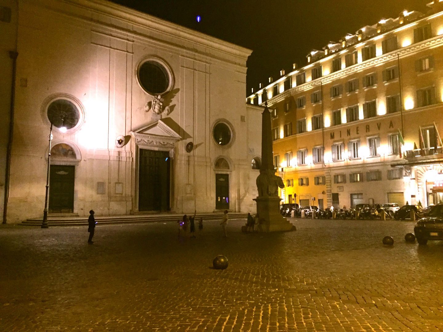 Playing vendor games in a piazza in Rome at night.