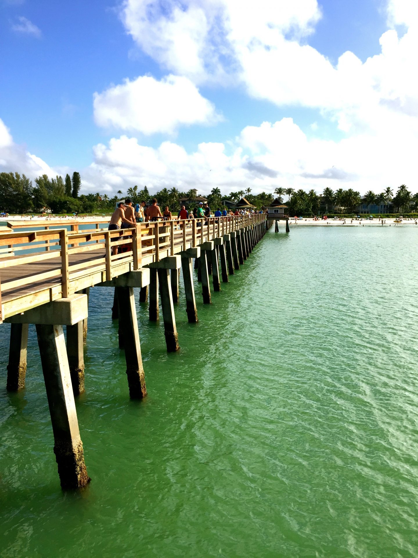 Aqua green water at the town pier in Naples Florida.
