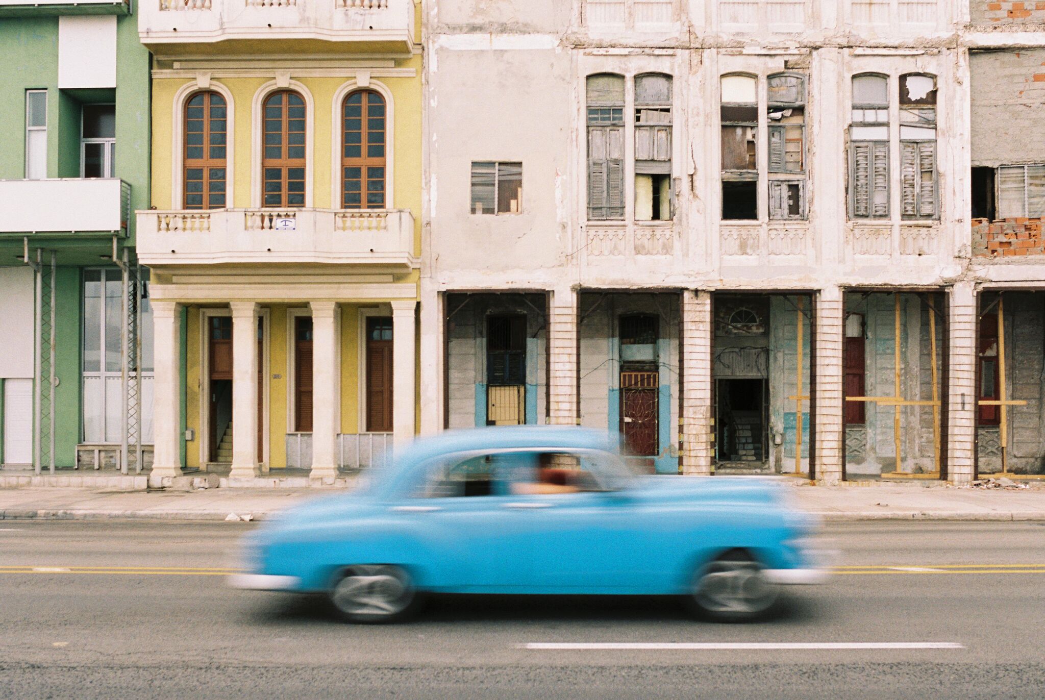 Car driving by in Cuba.