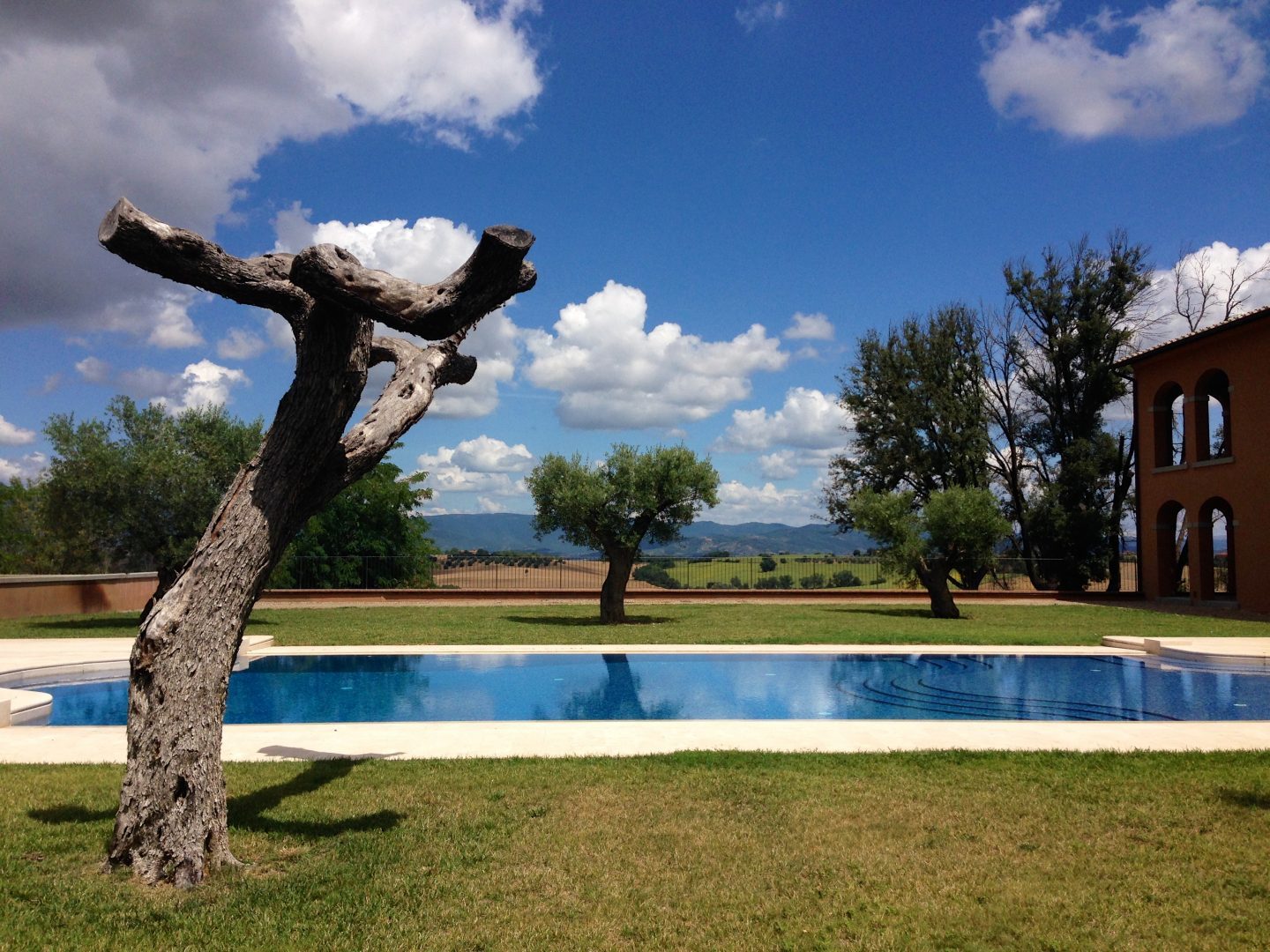 Chilling poolside at Villa Loggia winery in Cortona Tuscany.