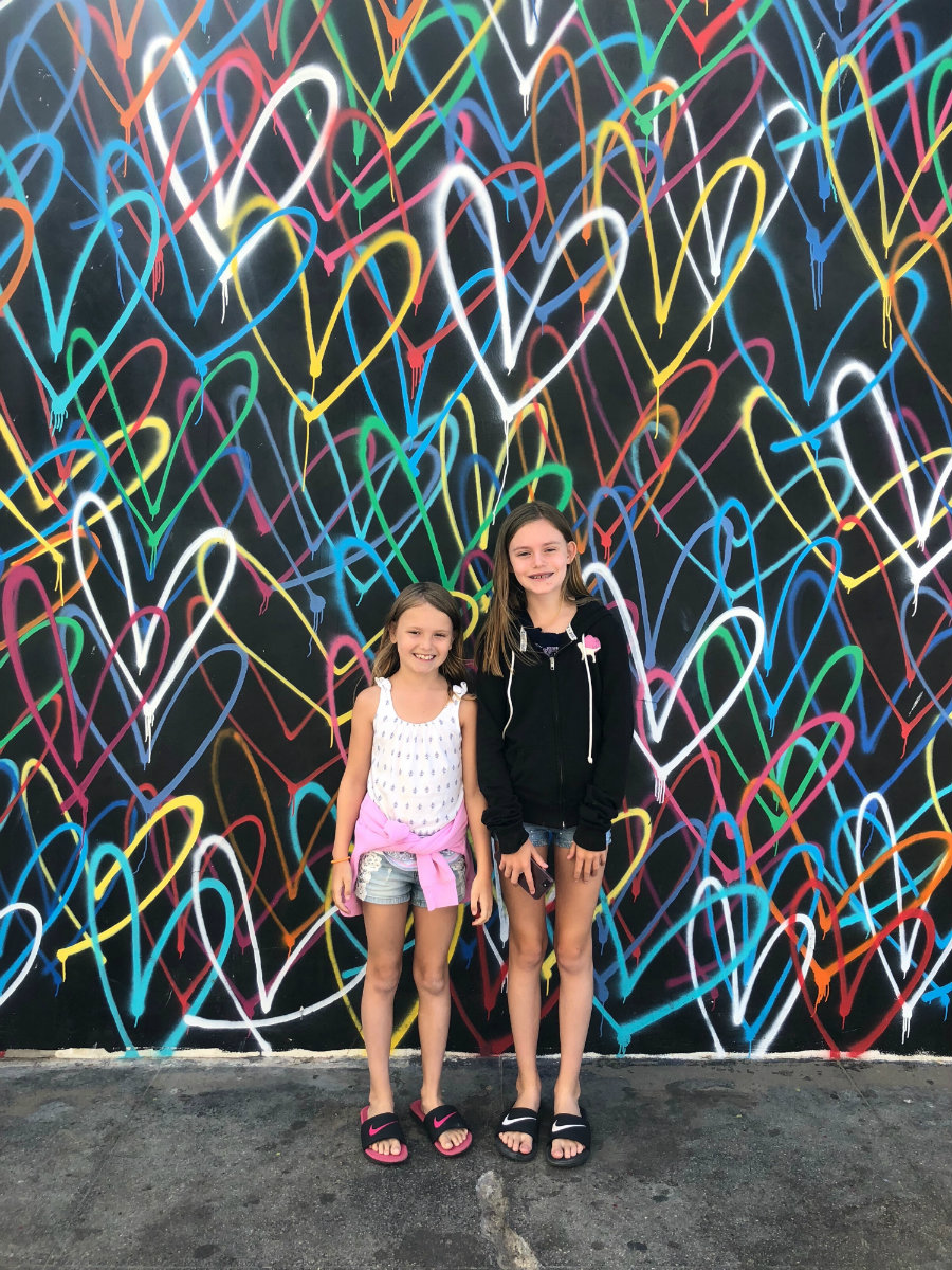 Looking at the Venice Beach street art with kids
